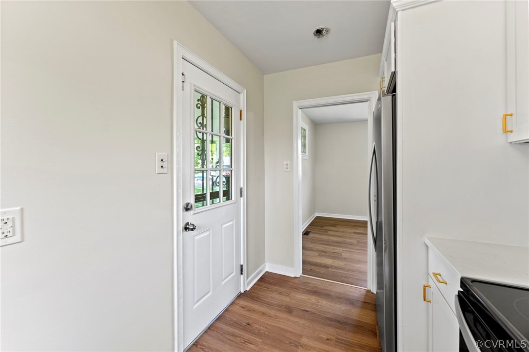 3319 Croydon Road Richmond, VA 23223 - Photo 11 of 22 a view of a hallway with wooden floor and staircase