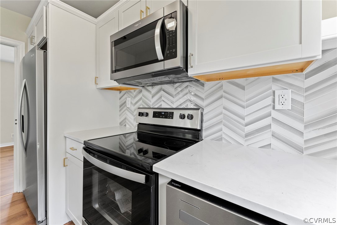 3319 Croydon Road Richmond, VA 23223 - Photo 12 of 22 a stove top oven sitting inside of a kitchen