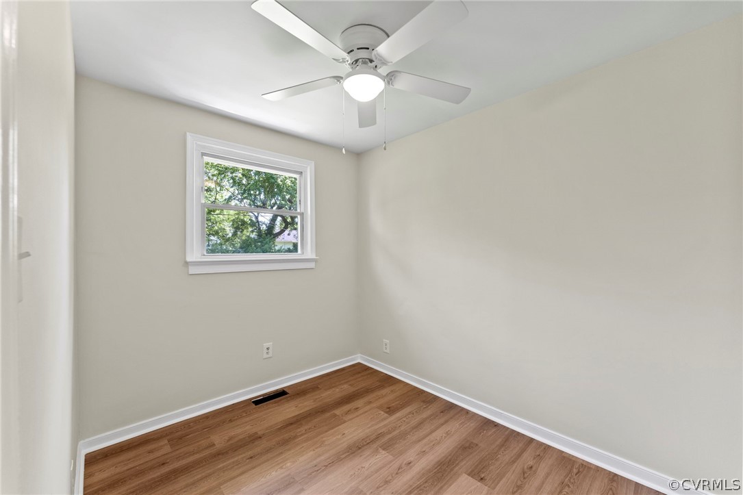 3319 Croydon Road Richmond, VA 23223 - Photo 15 of 22 an empty room with wooden floor and windows
