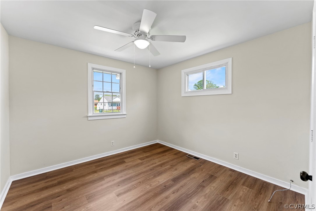 3319 Croydon Road Richmond, VA 23223 - Photo 19 of 22 wooden floor in an empty room with a window