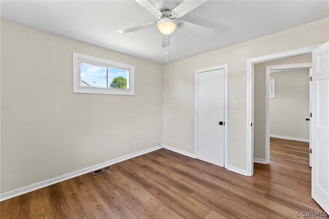 3319 Croydon Road Richmond, VA 23223 - Photo 20 of 22 an empty room with wooden floor and fan