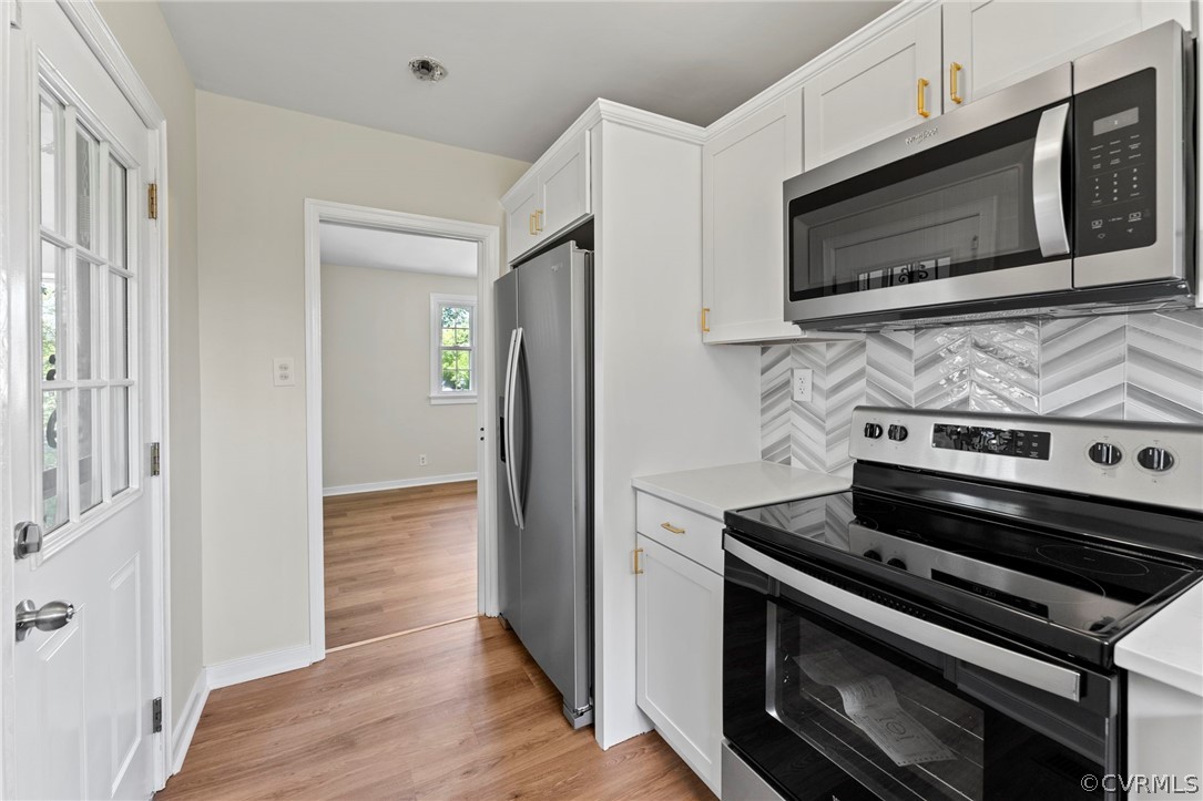 3319 Croydon Road Richmond, VA 23223 - Photo 10 of 22 a kitchen with a stove and a microwave