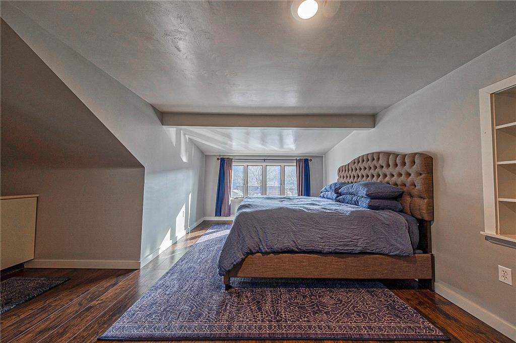 1440 Ohio Street Beaver, PA 15009 - Photo 18 of 36 a bedroom with a large bed and a chandelier