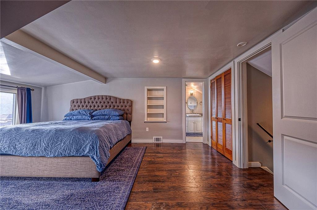1440 Ohio Street Beaver, PA 15009 - Photo 19 of 36 a spacious bedroom with a bed and wooden floor