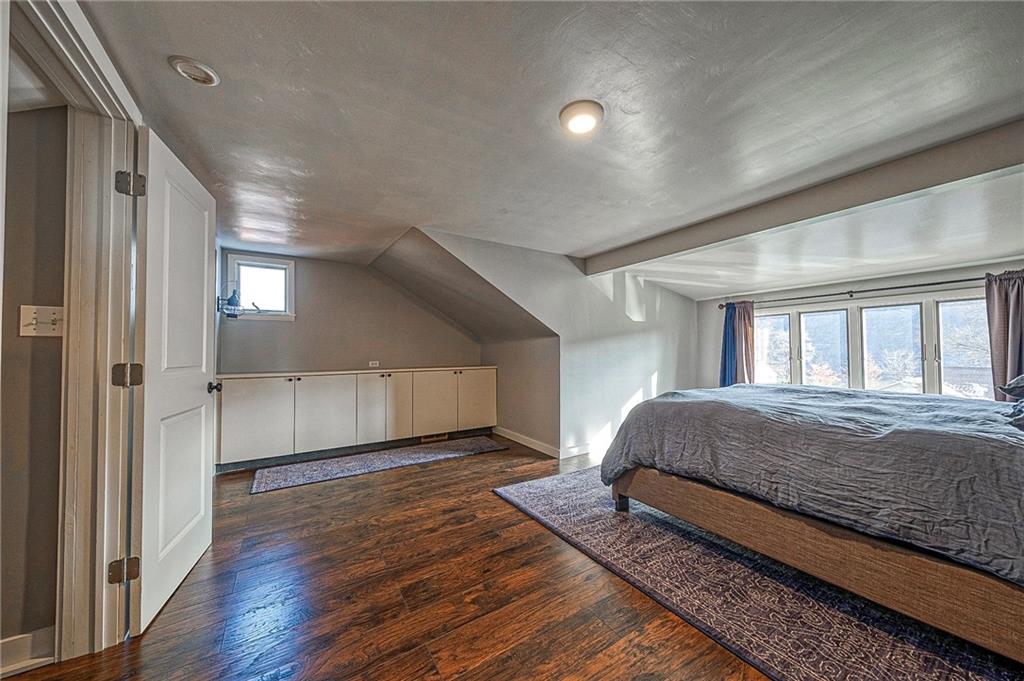 1440 Ohio Street Beaver, PA 15009 - Photo 20 of 36 a spacious bedroom with a large bed and a chandelier