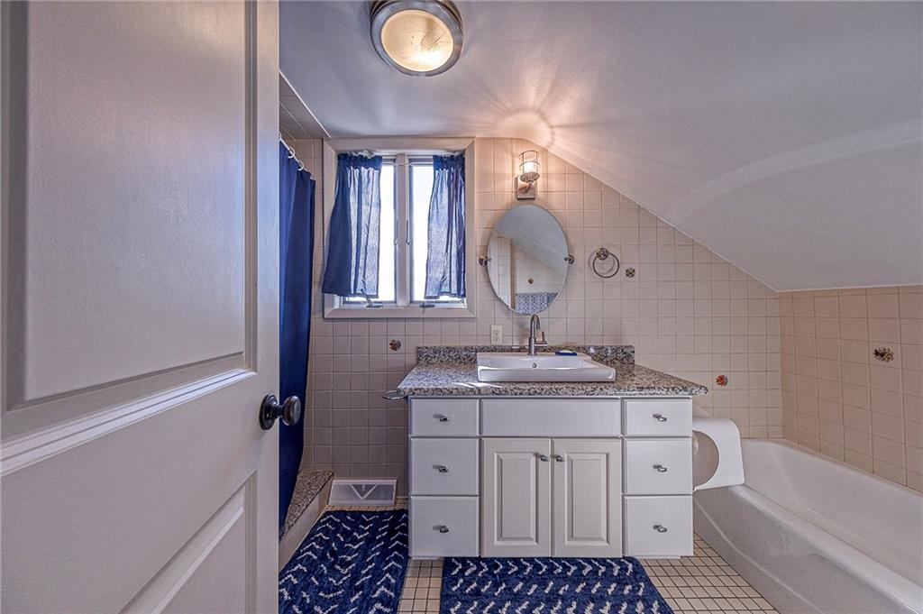 1440 Ohio Street Beaver, PA 15009 - Photo 21 of 36 a room with a stove a sink and a mirror