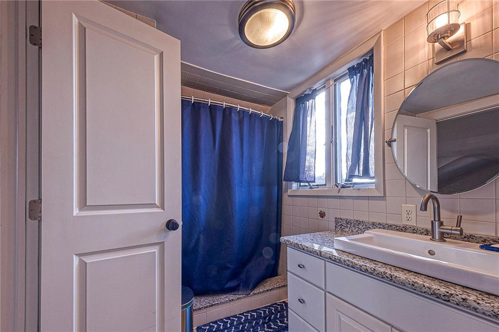 1440 Ohio Street Beaver, PA 15009 - Photo 23 of 36 a bathroom with a sink a vanity and a mirror