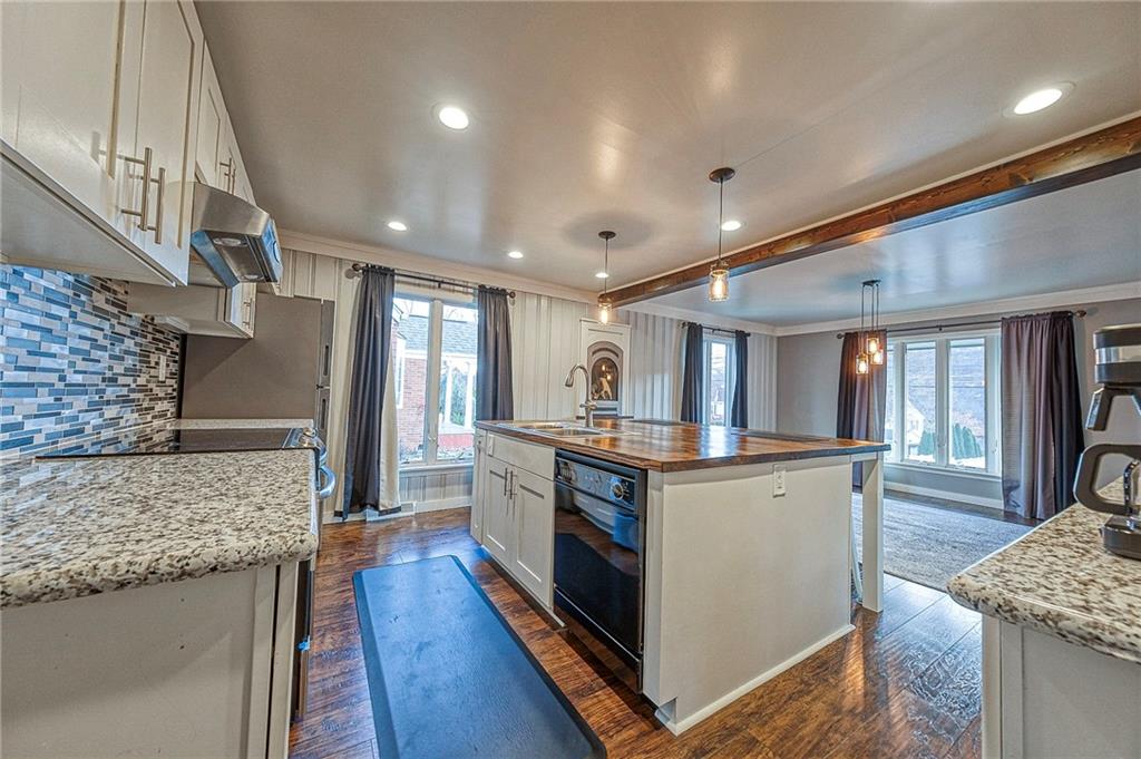 1440 Ohio Street Beaver, PA 15009 - Photo 8 of 36 a kitchen with stainless steel appliances granite countertop a stove and a refrigerator