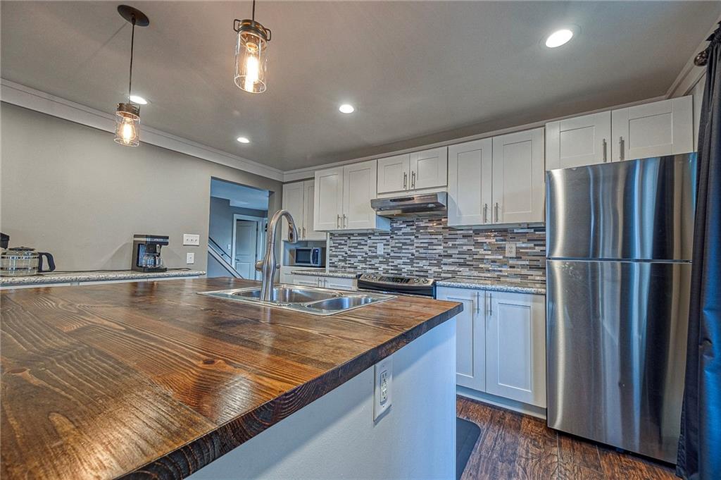 1440 Ohio Street Beaver, PA 15009 - Photo 9 of 36 a kitchen with stainless steel appliances granite countertop a refrigerator a sink and a stove