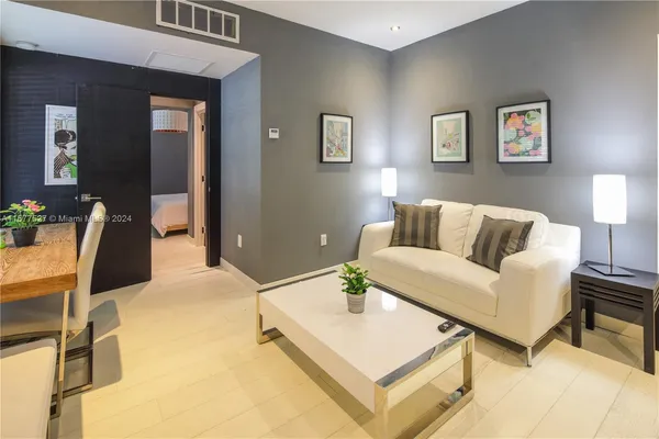 a living room with furniture and a table