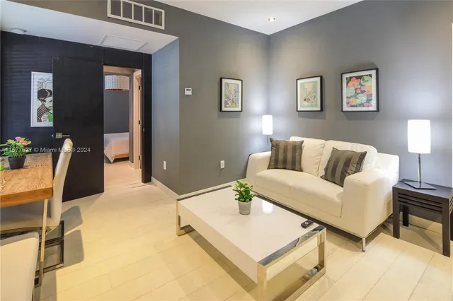 a living room with furniture and a table