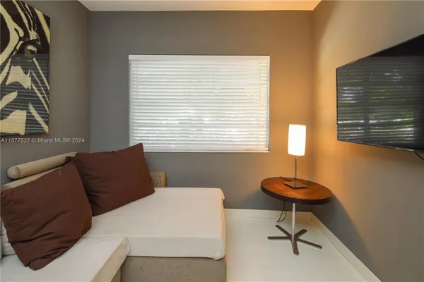 a view of living room with furniture and windows