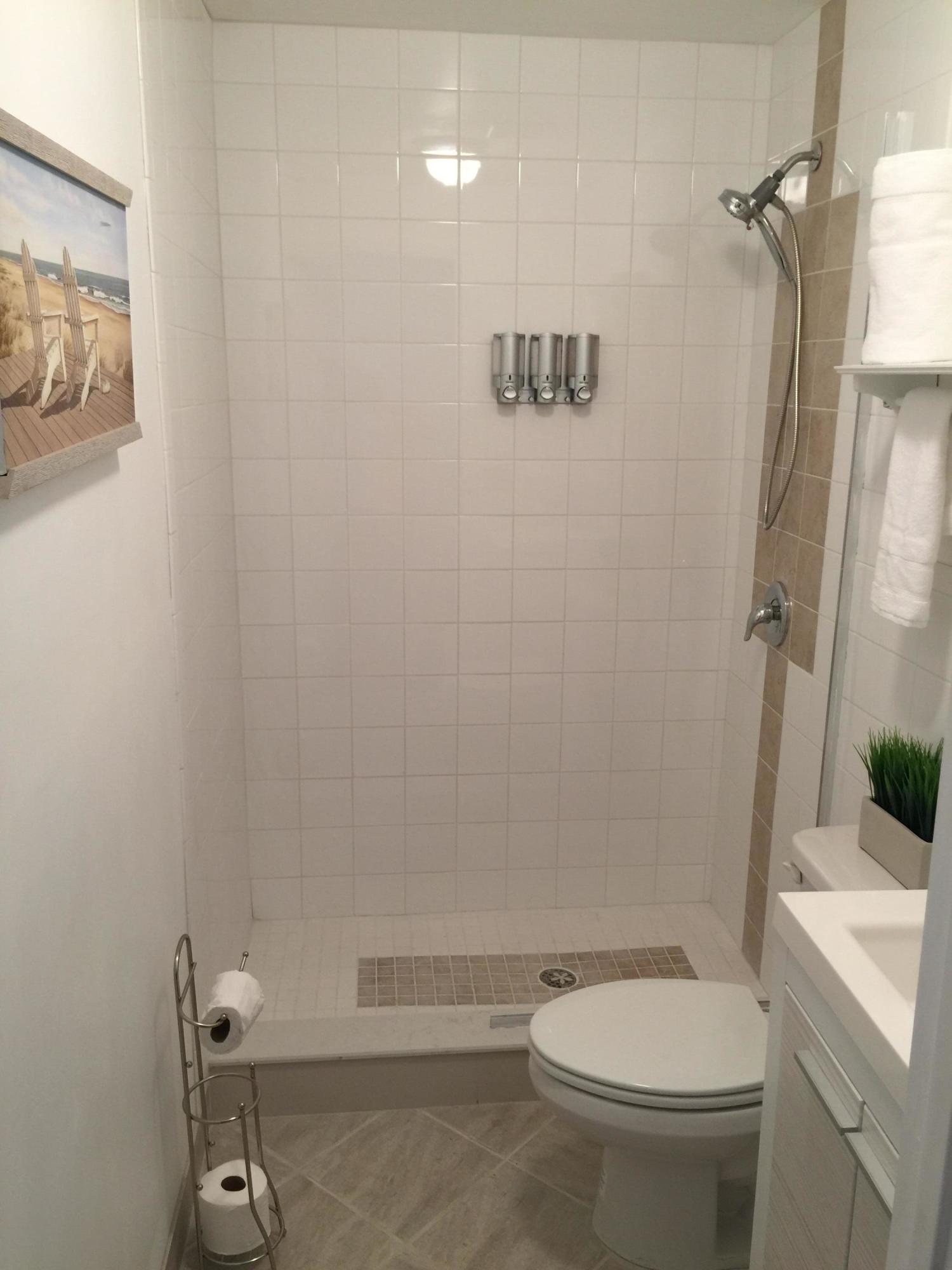 255 Cortez Road West Palm Beach, FL 33405 - Photo 12 of 26 a white toilet sitting next to a bathroom sink