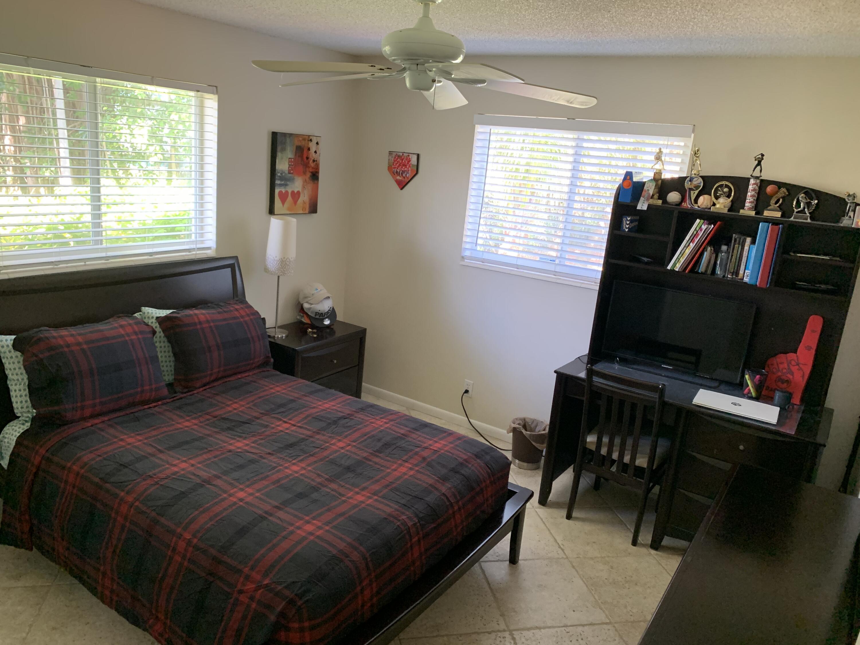 255 Cortez Road West Palm Beach, FL 33405 - Photo 16 of 26 a bedroom with a bed and a window