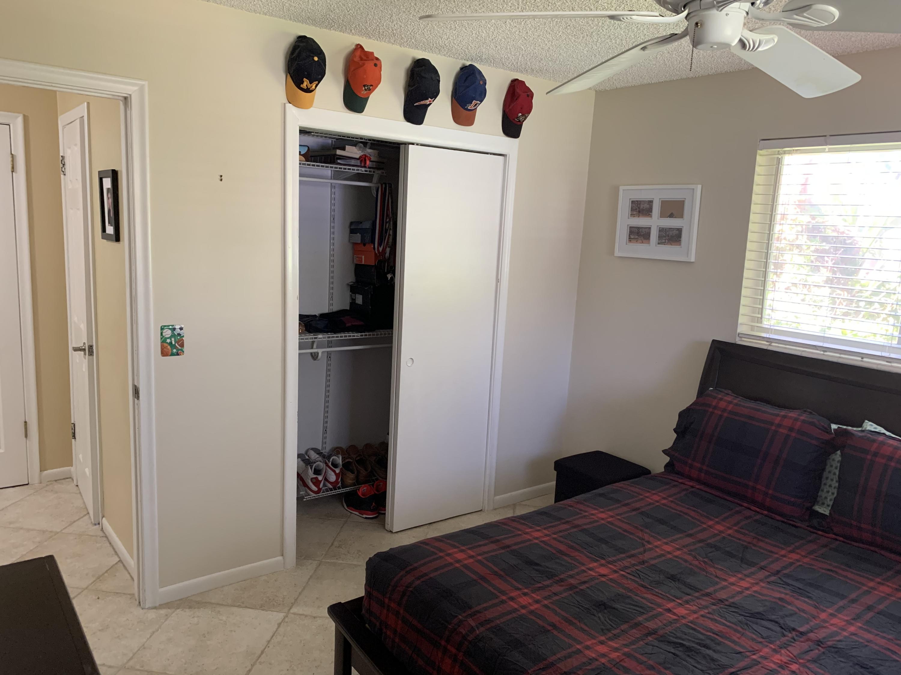 255 Cortez Road West Palm Beach, FL 33405 - Photo 17 of 26 a bedroom with a bed and a window