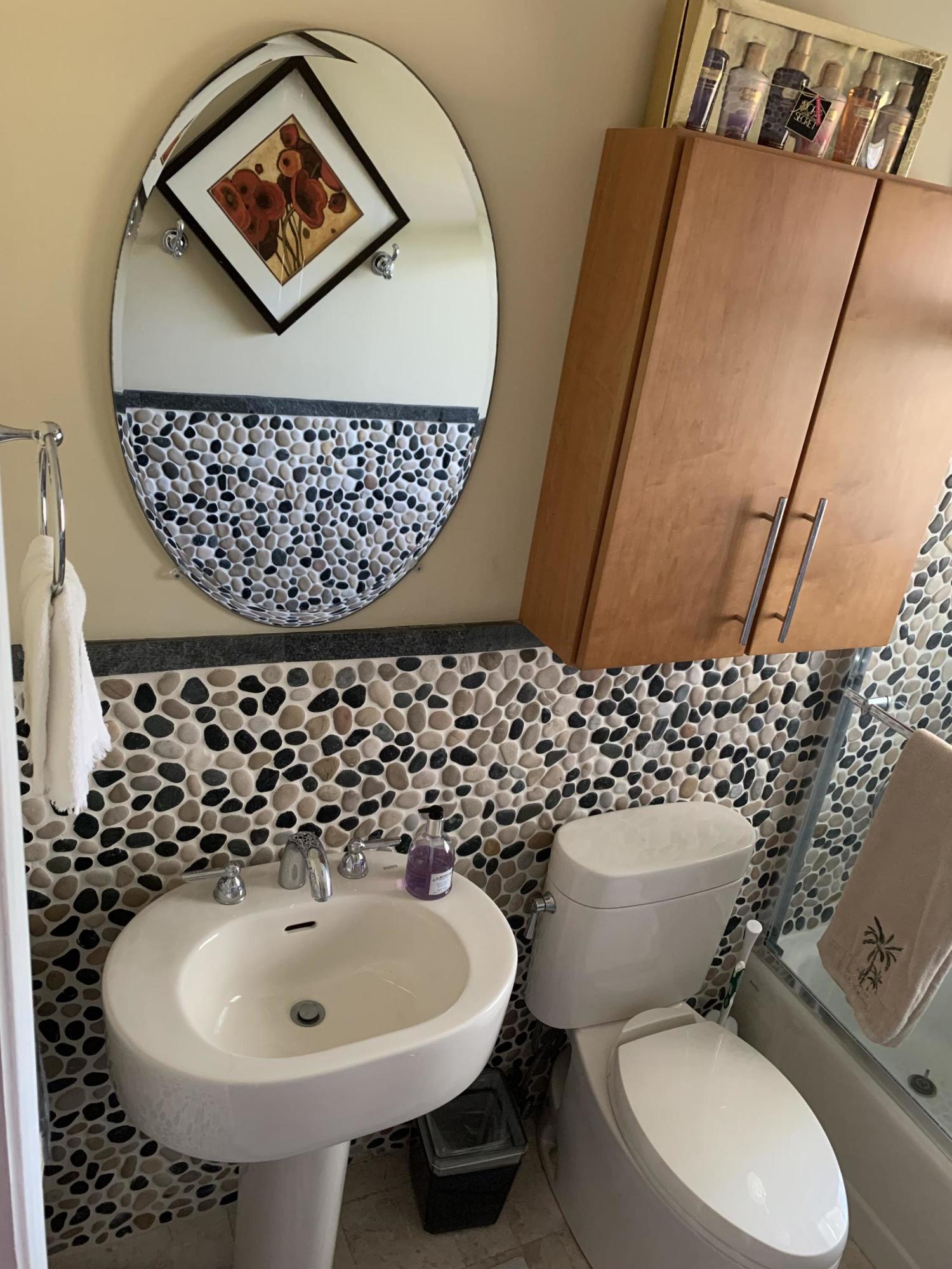 255 Cortez Road West Palm Beach, FL 33405 - Photo 18 of 26 a bathroom with a sink toilet and mirror