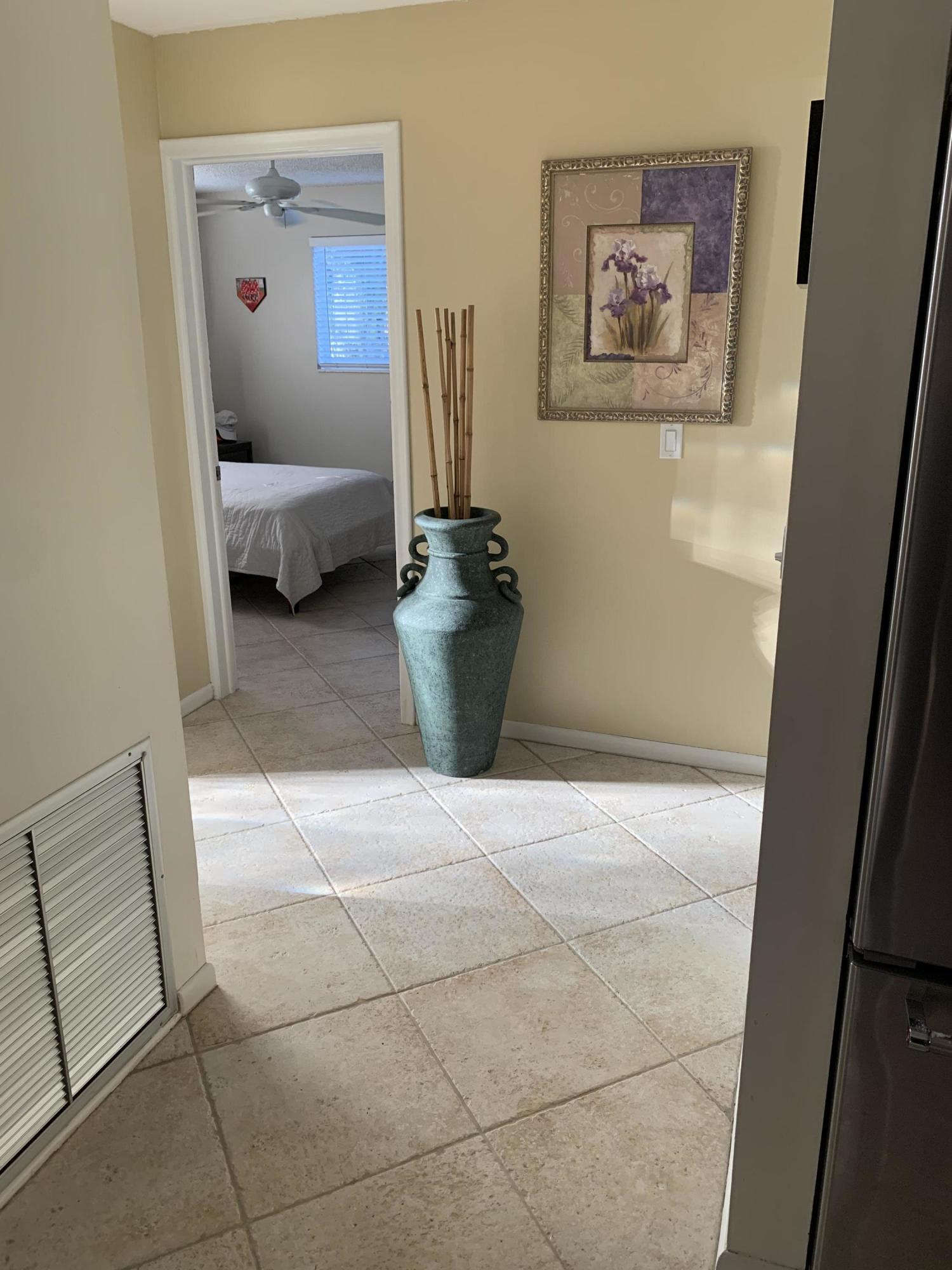 255 Cortez Road West Palm Beach, FL 33405 - Photo 10 of 26 a view of a hallway with workspace and mirror