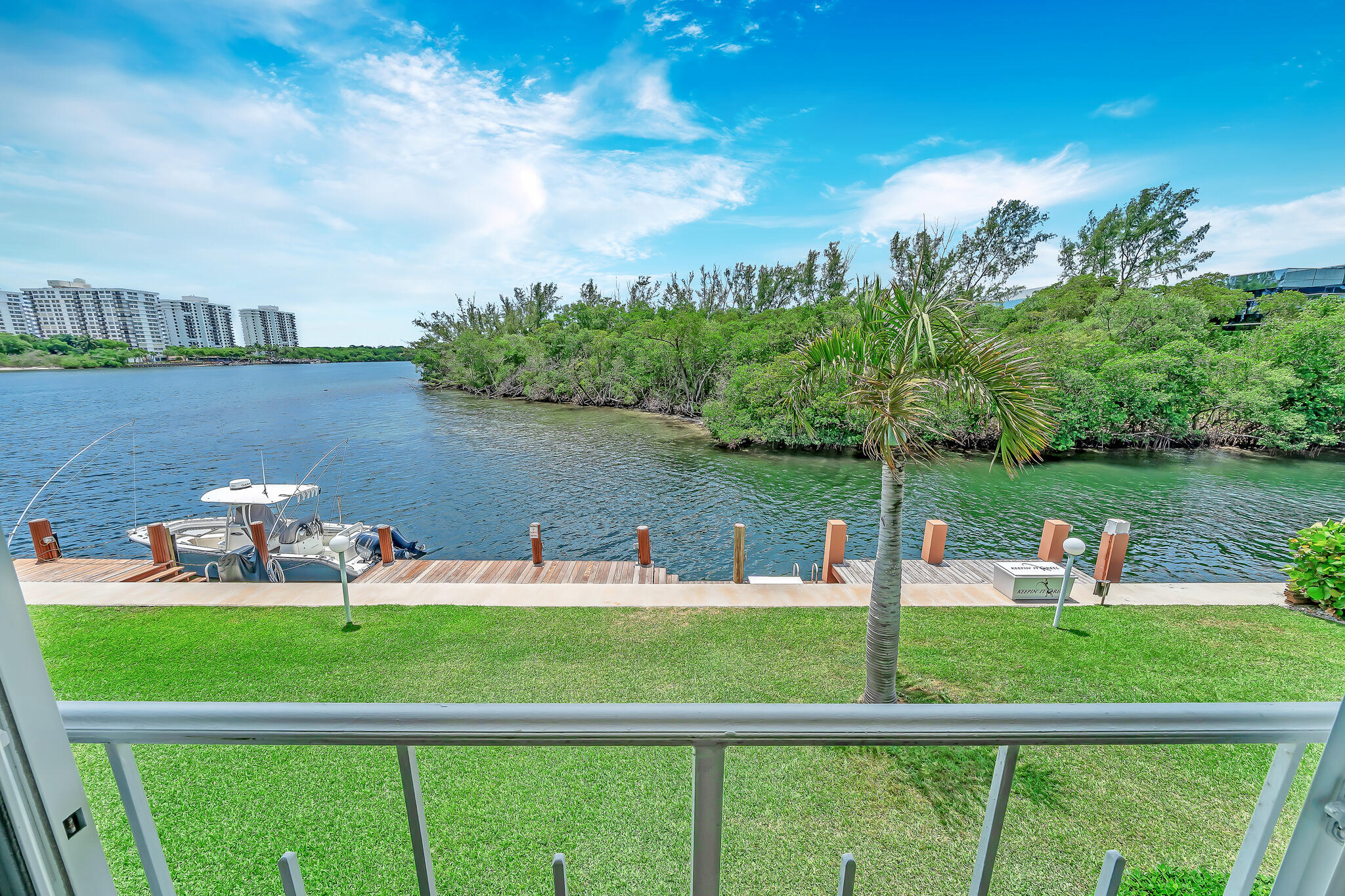 711 Northeast Harbour Terrace, Unit 4120 Boca Raton, FL 33431 - Photo 1 of 37 a view of a lake with houses