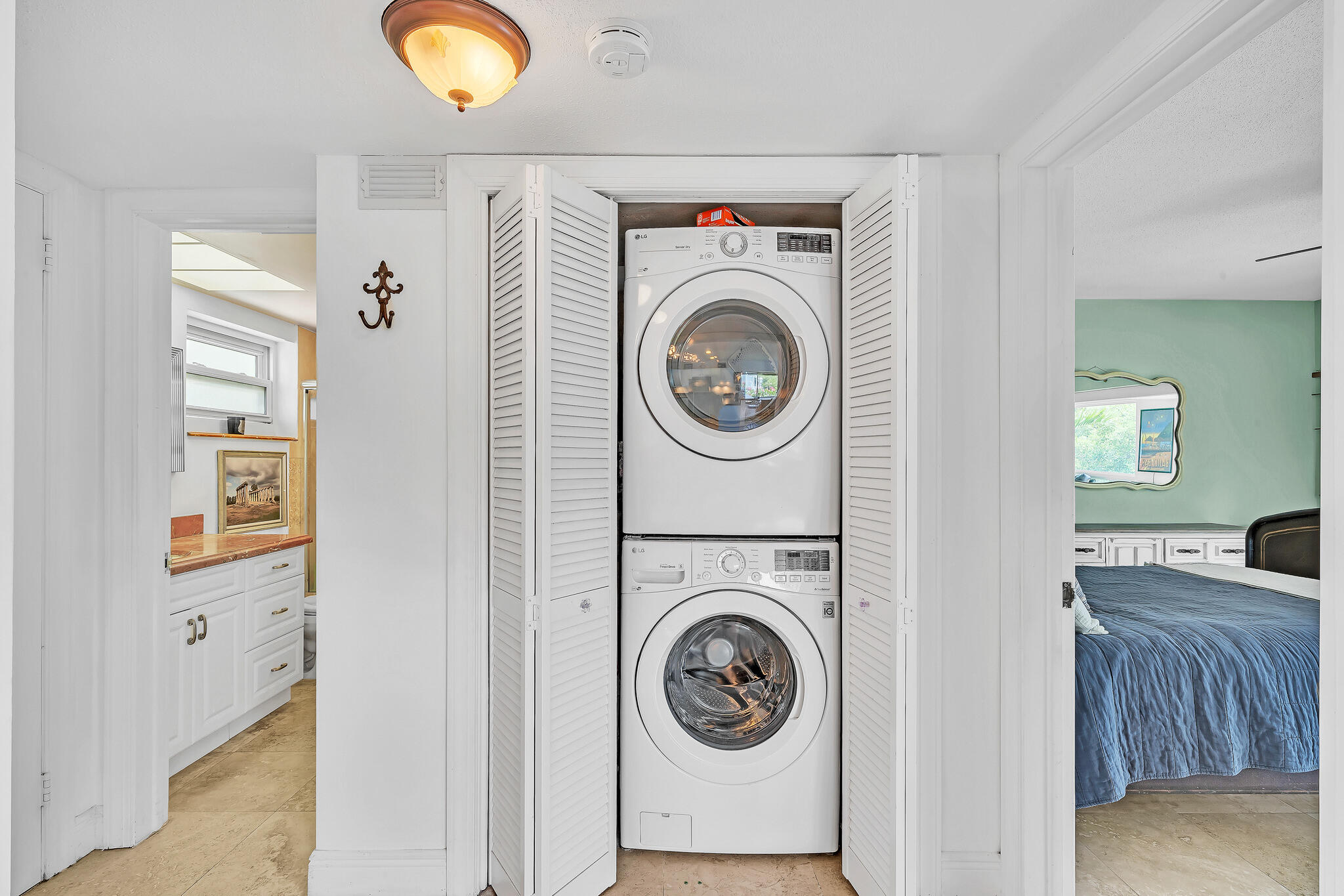 711 Northeast Harbour Terrace, Unit 4120 Boca Raton, FL 33431 - Photo 12 of 37 a utility room with dryer and washer
