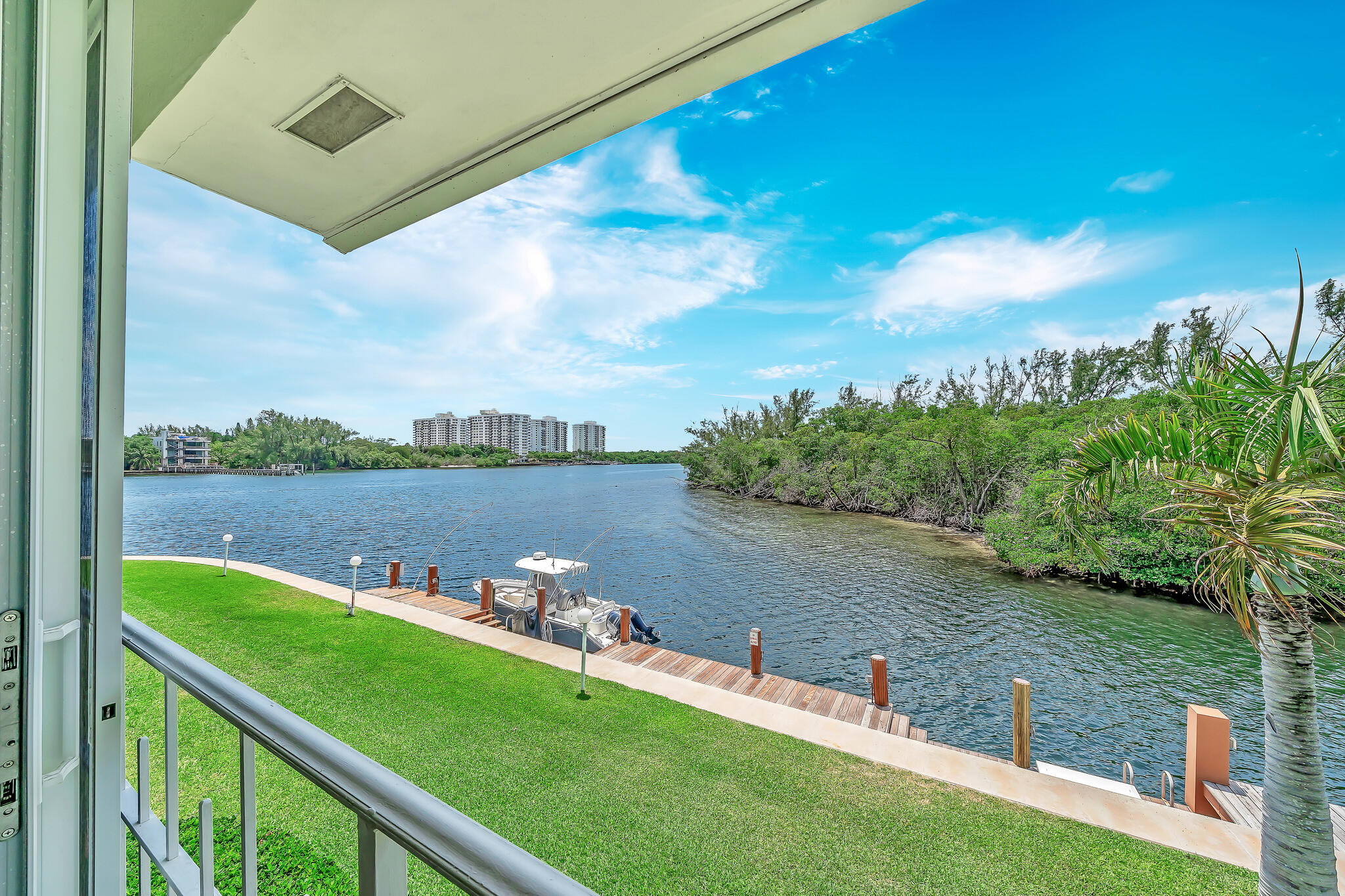 711 Northeast Harbour Terrace, Unit 4120 Boca Raton, FL 33431 - Photo 22 of 37 a view of a lake with a bridge