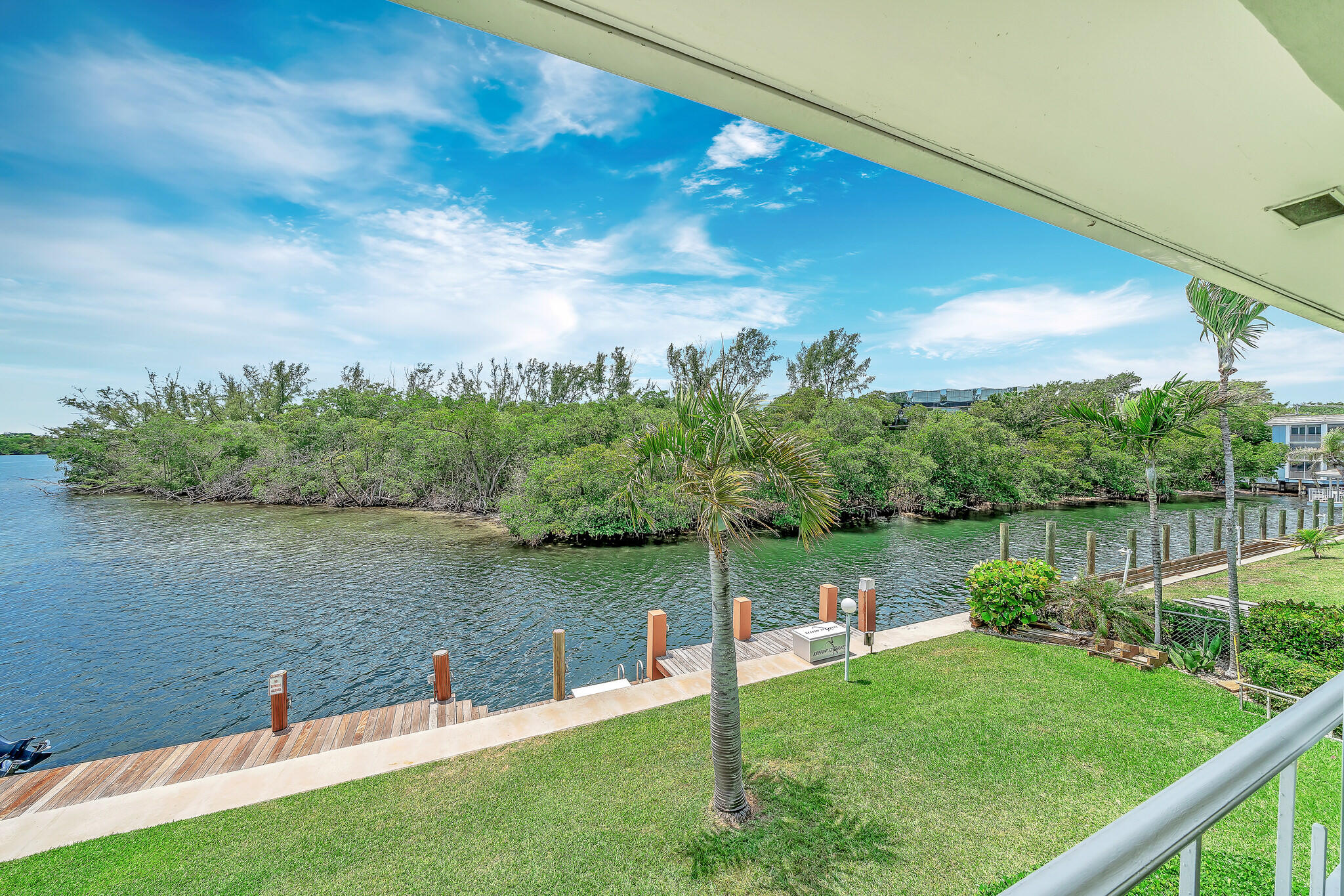 711 Northeast Harbour Terrace, Unit 4120 Boca Raton, FL 33431 - Photo 24 of 37 a view of a lake from a yard
