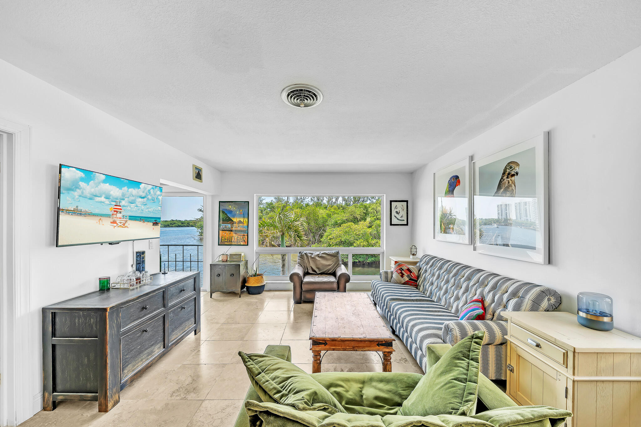 711 Northeast Harbour Terrace, Unit 4120 Boca Raton, FL 33431 - Photo 28 of 37 a living room with furniture and a large window