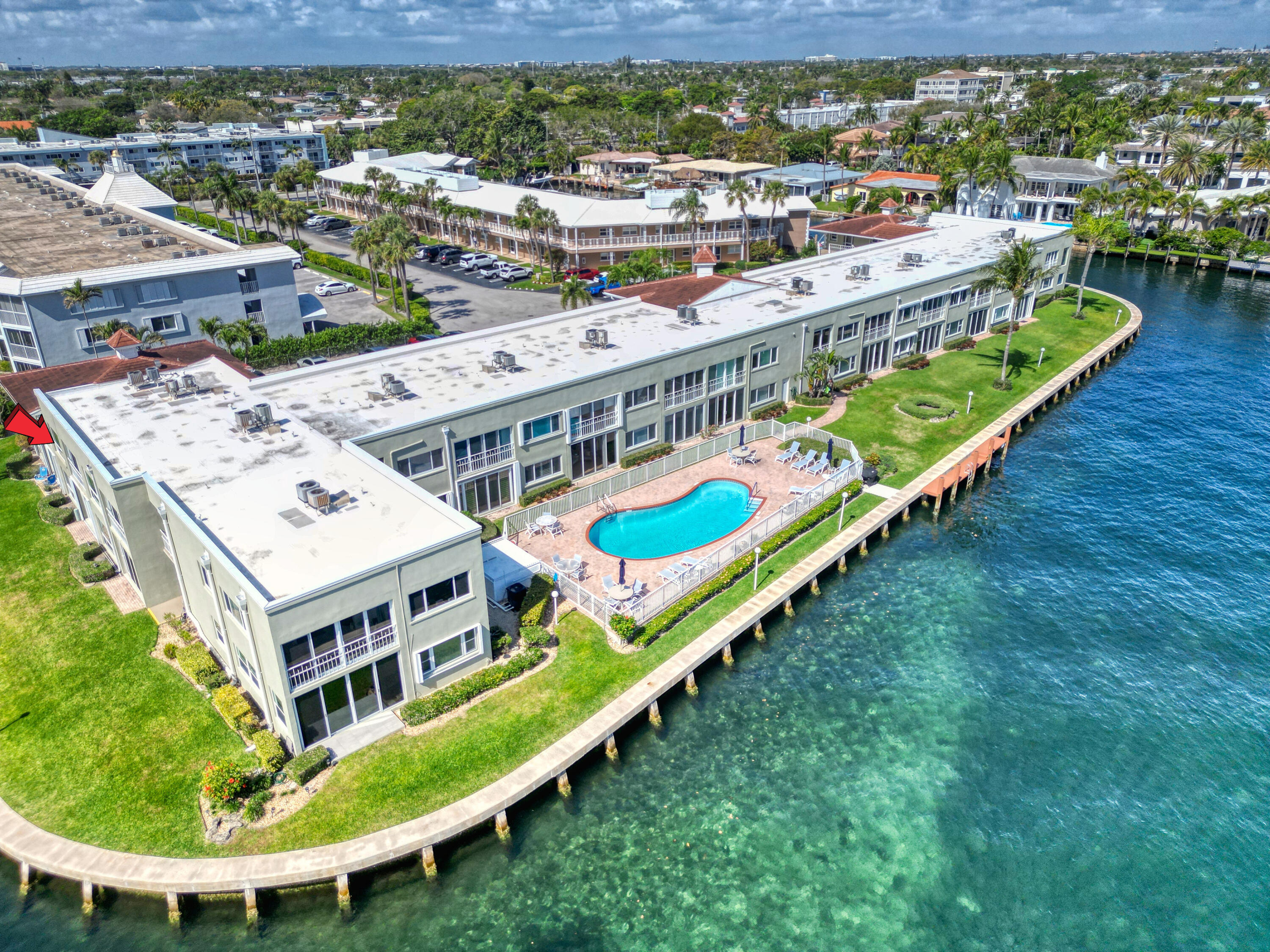 711 Northeast Harbour Terrace, Unit 4120 Boca Raton, FL 33431 - Photo 35 of 37 a view of a city with tall buildings and a big yard with swimming pool