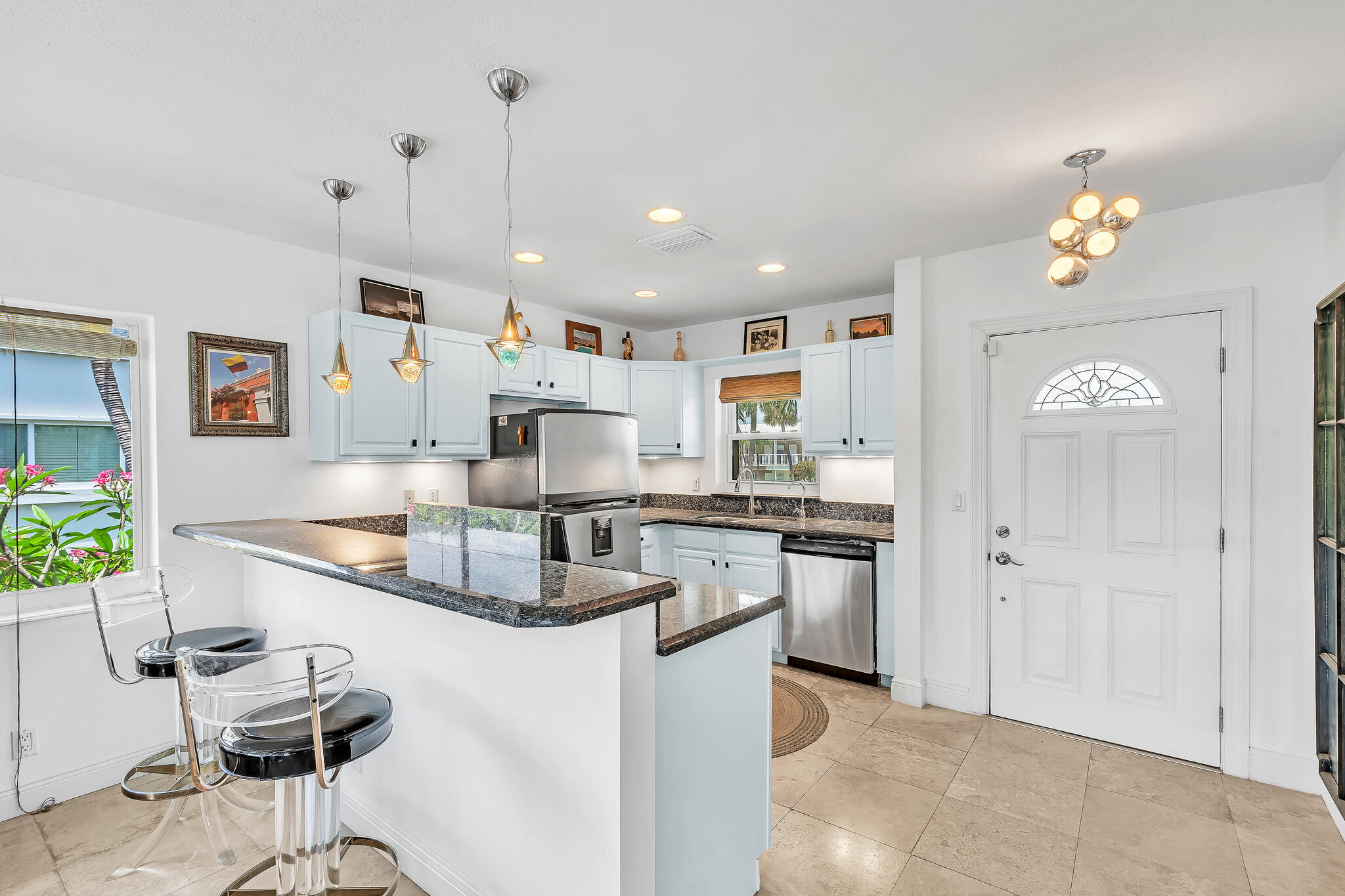 711 Northeast Harbour Terrace, Unit 4120 Boca Raton, FL 33431 - Photo 9 of 37 a kitchen with stainless steel appliances granite countertop a sink stove and refrigerator