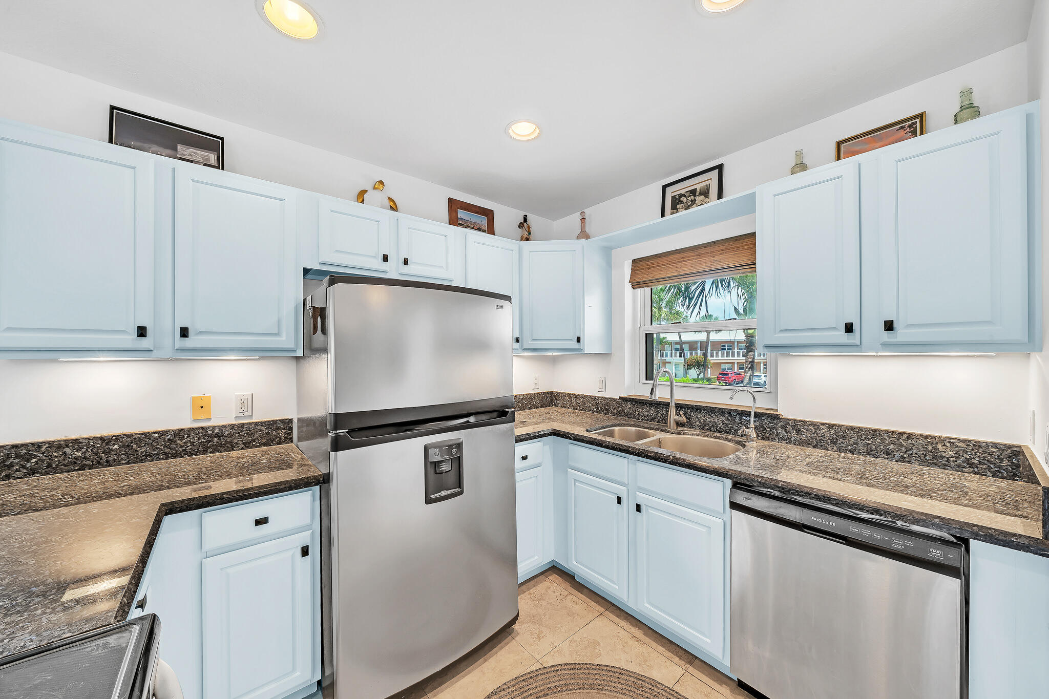 711 Northeast Harbour Terrace, Unit 4120 Boca Raton, FL 33431 - Photo 10 of 37 a kitchen with granite countertop cabinets stainless steel appliances and a sink