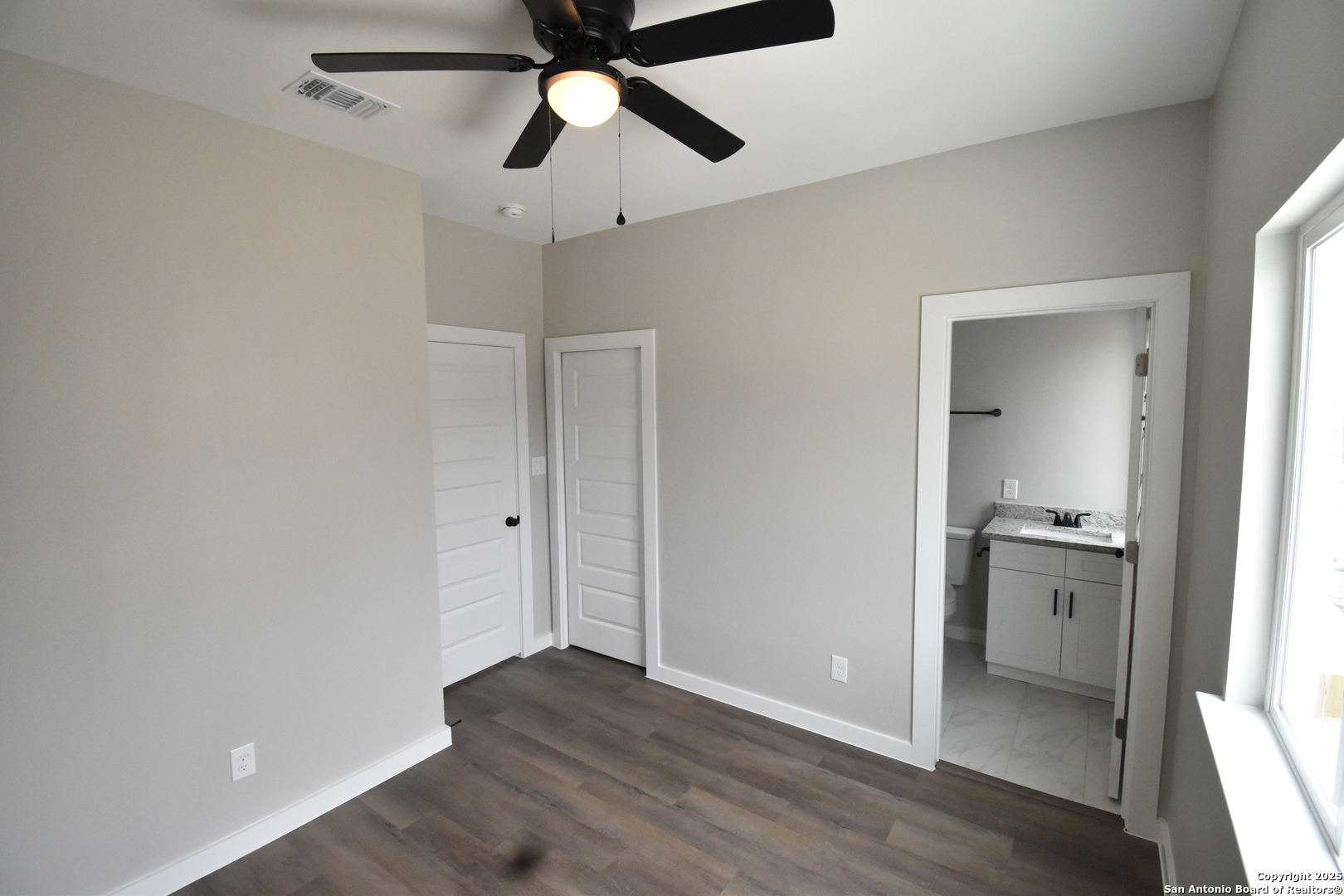 6402 Tahoka Road San Antonio, TX 78227 - Photo 19 of 21 wooden floor in an empty room with a kitchen