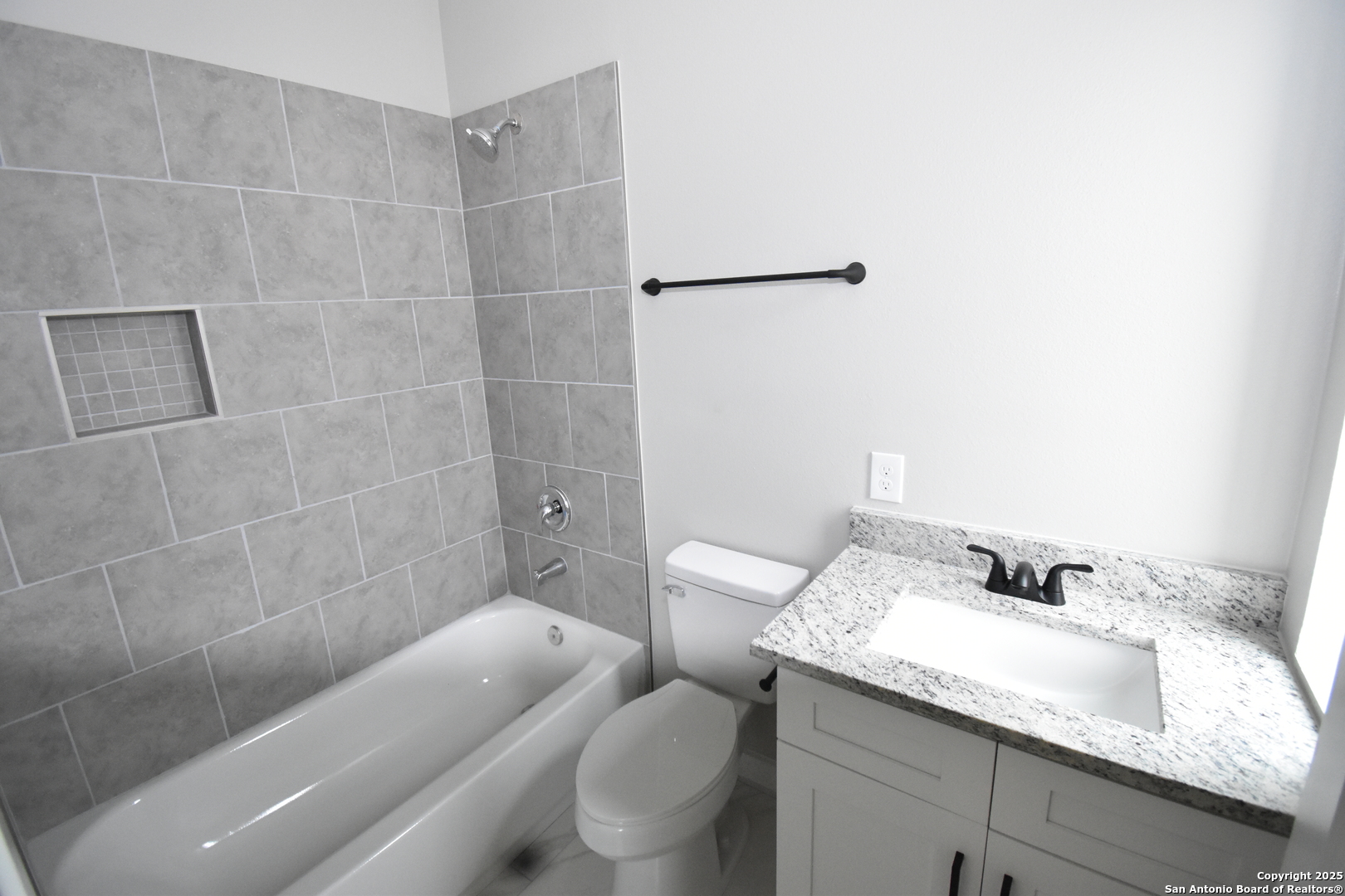 6402 Tahoka Road San Antonio, TX 78227 - Photo 21 of 21 a bathroom with a granite countertop sink and a mirror