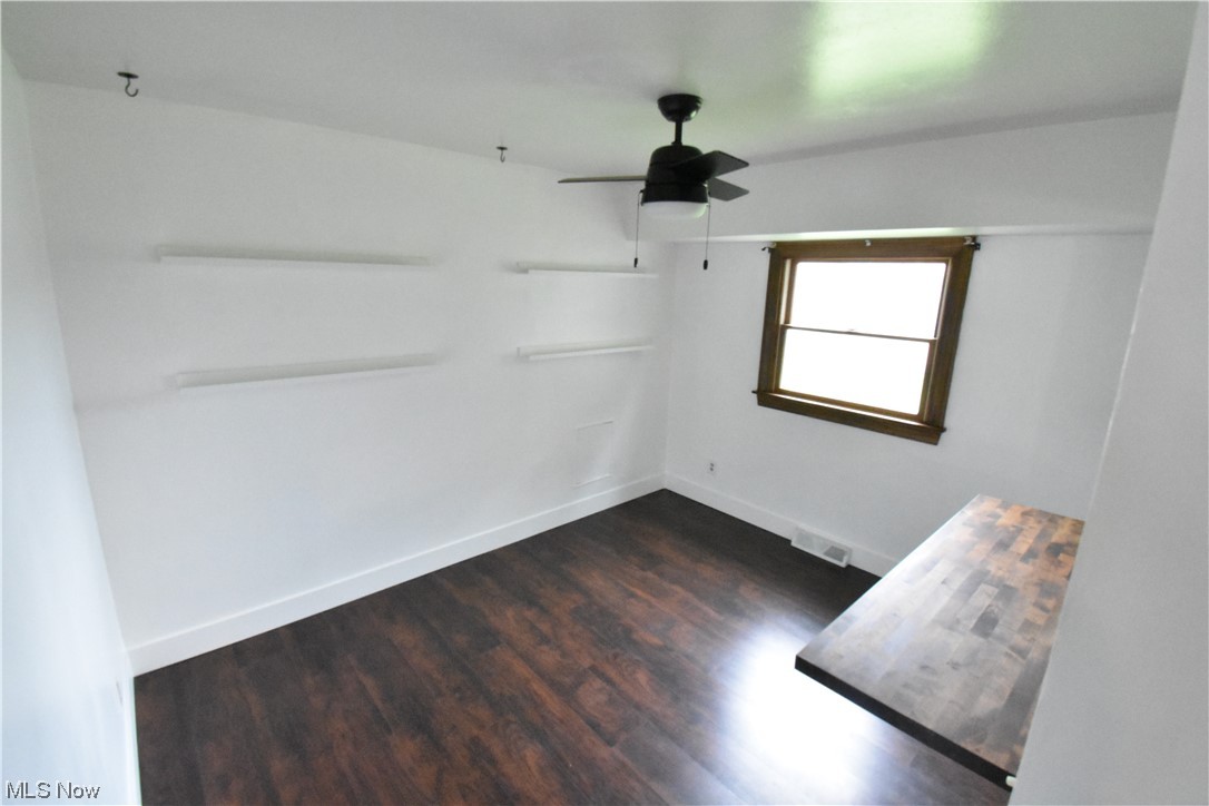 4638 Burkey Road Youngstown, OH 44515 - Photo 10 of 23 Hardwood floored empty room with ceiling fan
