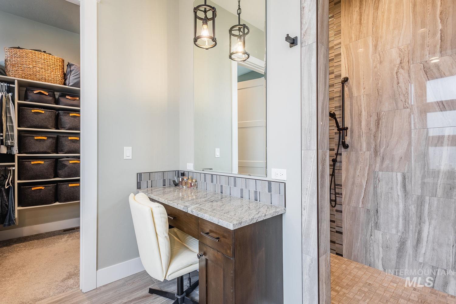 4078 West Wapoot Street Meridian, ID 83646 - Photo 23 of 46 Full bathroom featuring a walk in closet, a walk in shower, and vanity