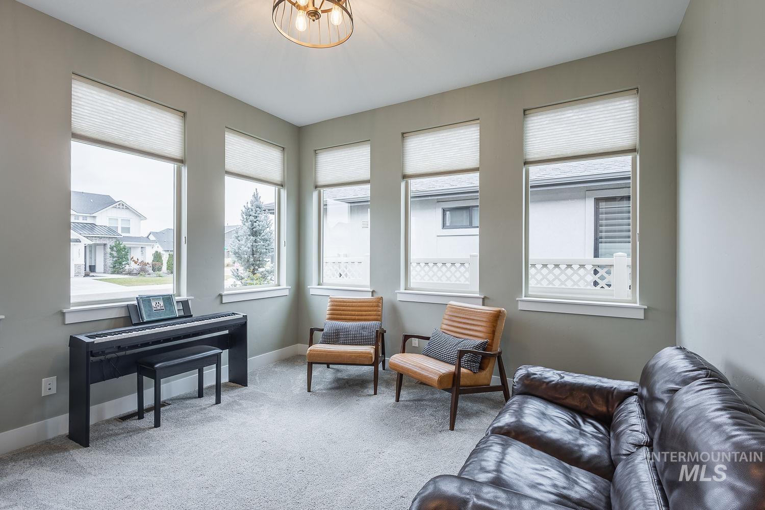 4078 West Wapoot Street Meridian, ID 83646 - Photo 25 of 46 Living area with light colored carpet and healthy amount of natural light