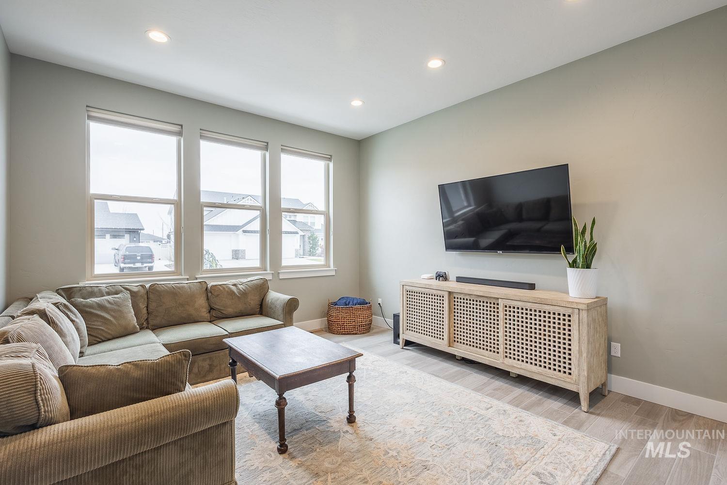 4078 West Wapoot Street Meridian, ID 83646 - Photo 34 of 46 Living area with wood finish floors and recessed lighting