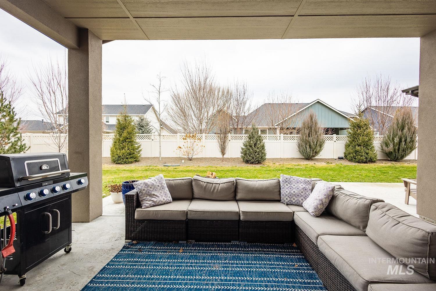 4078 West Wapoot Street Meridian, ID 83646 - Photo 41 of 46 Fenced backyard with a patio area, grilling area, and outdoor lounge area