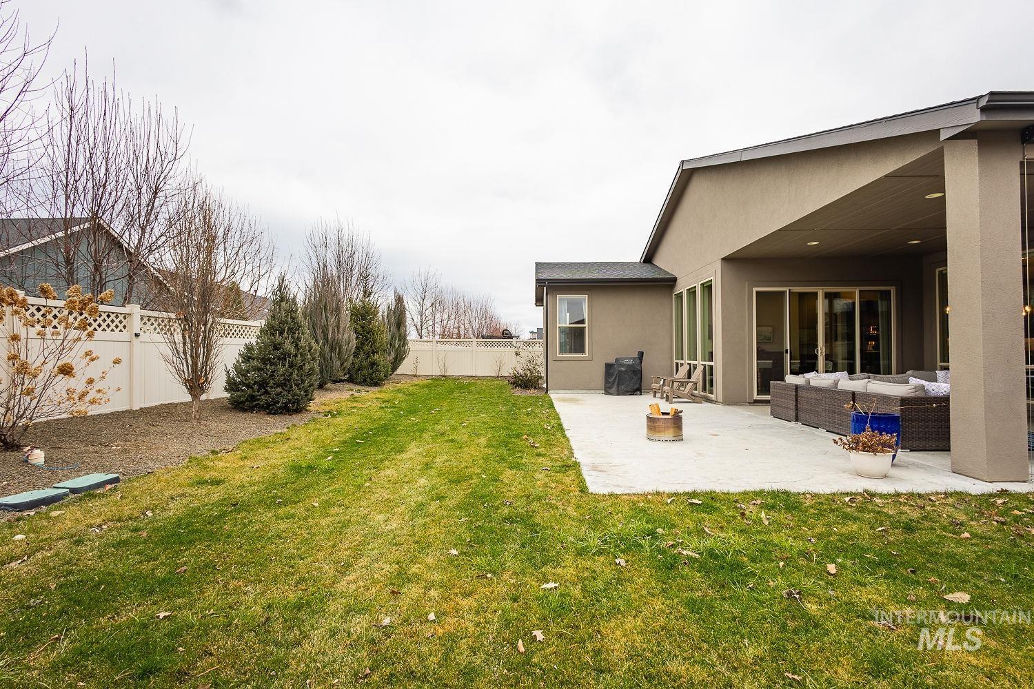 4078 West Wapoot Street Meridian, ID 83646 - Photo 42 of 46 Fenced backyard with outdoor lounge area and a patio area