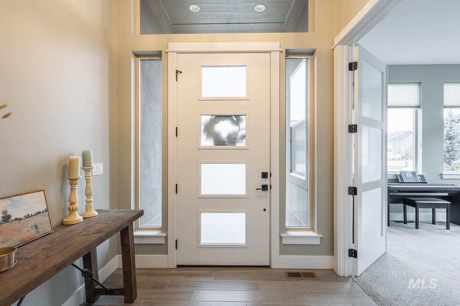 4078 West Wapoot Street Meridian, ID 83646 - Photo 5 of 46 Entryway with wood finished floors and baseboards