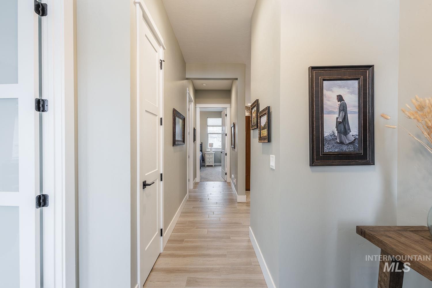 4078 West Wapoot Street Meridian, ID 83646 - Photo 6 of 46 Corridor with baseboards and light wood-style flooring