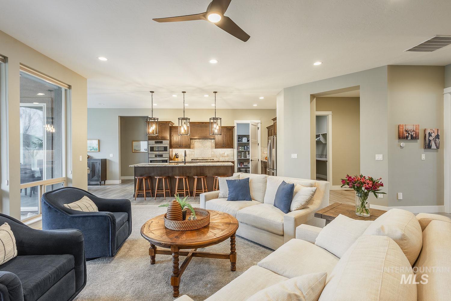4078 West Wapoot Street Meridian, ID 83646 - Photo 9 of 46 Living room with ceiling fan and recessed lighting