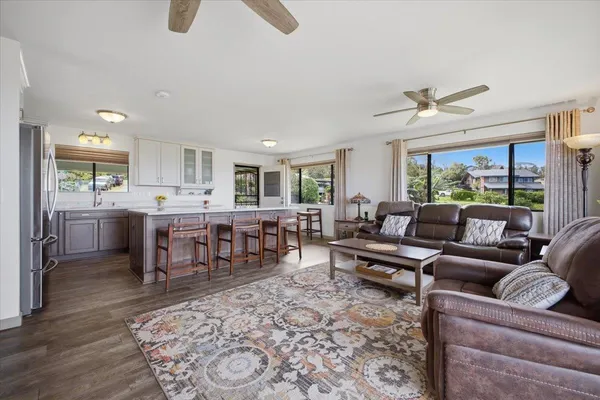 a large kitchen with stainless steel appliances lots of counter top space