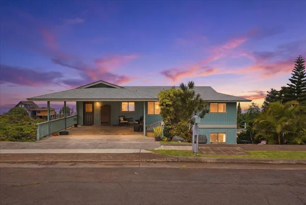 an aerial view of residential houses with outdoor space and street view