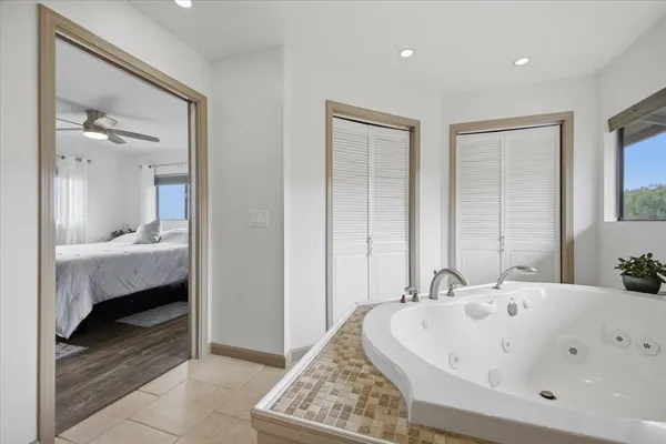 a kitchen with a refrigerator and a stove