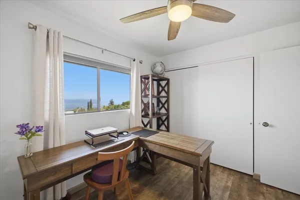 a bedroom with a bed and a chair