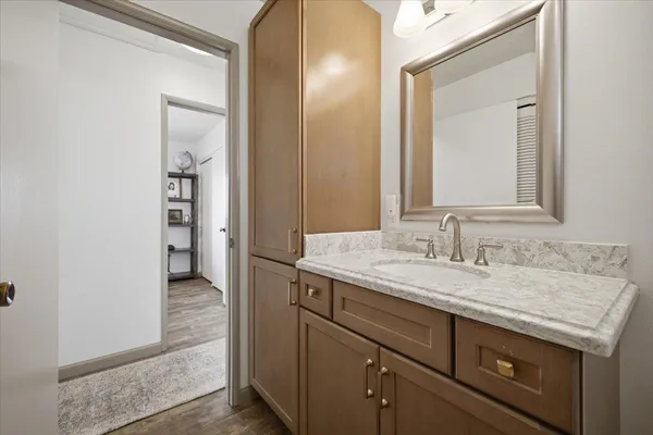 a bedroom with a bed and a chair