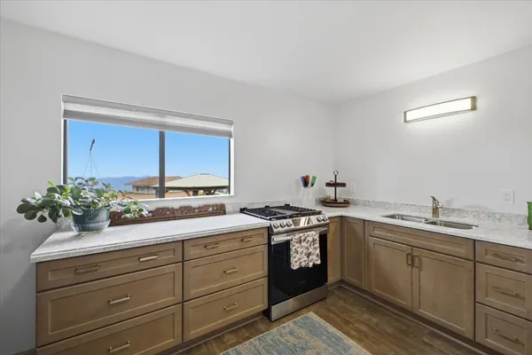a view of balcony with wooden floor and fence