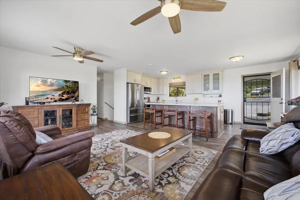 a kitchen with a stove a sink and a refrigerator