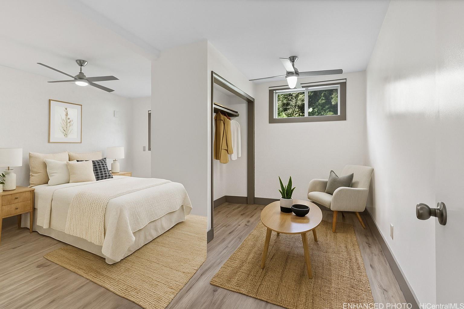 54-230 Hauula Homestead Road, Unit A Hauula, HI 96717 - Photo 11 of 22 a bedroom with a bed and glass door