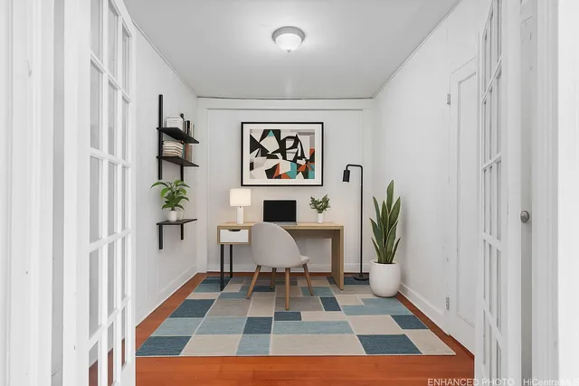 a living room with furniture and a rug