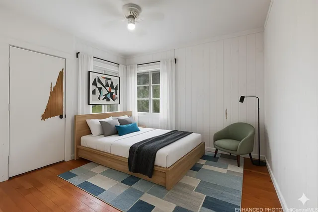 a bedroom with a bed and window